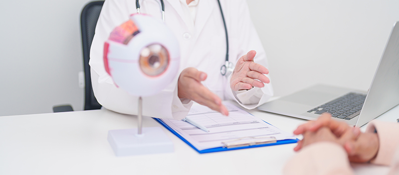 A patient receiving a consultation at an ophthalmologist