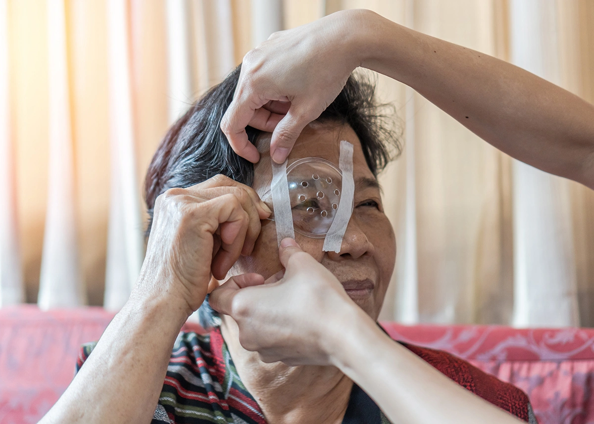 A cataract surgeon providing follow-up care after surgery